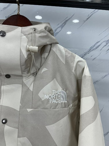 The North Face x KAWS Mountain Jacket – Cream/Sand Print